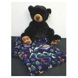 Small winter throw blanket and large plush bear