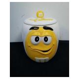 Vintage yellow M&M 6.5 in canister with lid