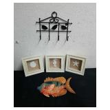 Three ocean themed pictures, fish wall decor, and