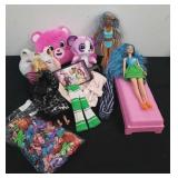 Couple barbies, some plush toys, and Barbie