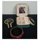 Small travel jewelry box and three bracelets