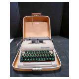 Sterling Smith-Corona typewriter in a travel case