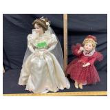 2 Porcelain dolls with stands