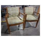 Wooden guest chairs with green fabric