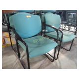 Guest chairs with green fabric on black frame