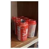 Six cans of sin bin, red ale, medicine, hat,