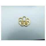 9K Gold Olympic Pendant   .87 grams