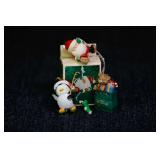 1986 ENESCO HOLIDAY FISHERMAN PENGUIN ORNAMENT - 1992 LUSTRE FAME LTD TOYS IN BAG ORNAMENT - 1984 HALLMARK SANTA MOUNTAIN CLIMBER ORNAMENT