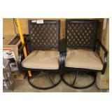 2 swivel chairs w tan cushions