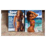 2 stacks of Sports Illustrated Swimsuit models