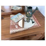 Assorted dresser toppings. Round mirror, tray,