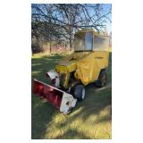 Cub cadet mower with windbreaker and plow