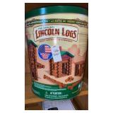 Lincoln logs in metal tin