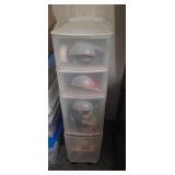 Four drawer organizer on wheels full of various