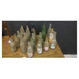 24 Assorted antique glass bottles