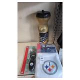 Steelers water bottle , gold towel, and bottle