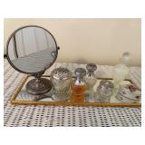 Mirrored tray with bottles and mirror