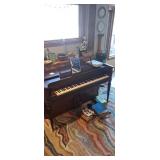 Aerosonic Upright piano with sheet music.