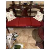 Carved Wooden Bench with Swan Motif and Red Cushio