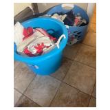 Two Plastic Laundry Baskets Filled with Clothing