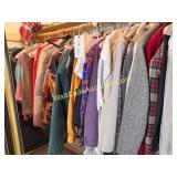 Lot of Clothes Hanging in Closet Various Sizes and