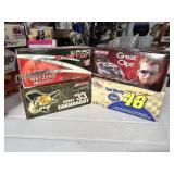 4 cast metal NASCAR models in boxes