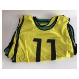 12 numbered reversible green/yellow sports vests