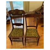 2 oak and green padded chairs