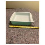 Green and white Pyrex dish