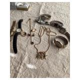 Assorted jewelry items including watches