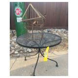 Round wrought, iron side table, and small birdcage