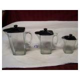 GRADUATED SET OF 3 GLASS PITCHERS W/ BLACK GLASS