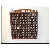 Symbol collection in wood display case with