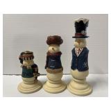 Three snowman candle holders