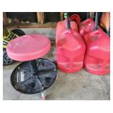 Gas cans, 4- 5 gallon gas jugs and a red