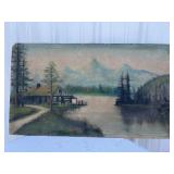 Painting of mountains and cabin by water sign