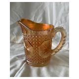 Carnival glass pitcher