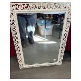 Large mirror framed in cast-iron