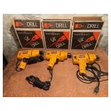 Three MasterCraft 1/4in Corded Drills in Boxes