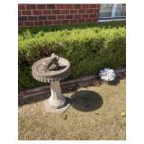 Birdbath and concrete flowers