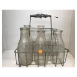 6 Milk bottles & Metal Carrier