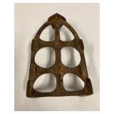 Cast iron trivet.