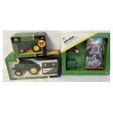 3 packaged John Deere tractor toys