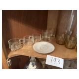 Cups, stem glasses, coffee pot, plate