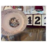 LIMOGES PLATE ON STAND IN DINING ROOM