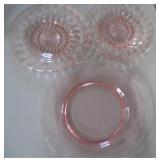 pink depression glass plates .