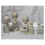 4 precious moments figurines