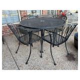 Wrought iron round table with (4) barrel back chairs…..42”D x 29” tall…..chairs 18 w x 17 deep x 31-1/4” tall overall