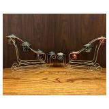 Pair of very nice gold-tone sleighs with votive candle holder slots…..11” long x 7-122” tall