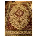 Capel Rugs 7’8” x 10’10” nylon rug in good condition…..in shades of red, tan, blue